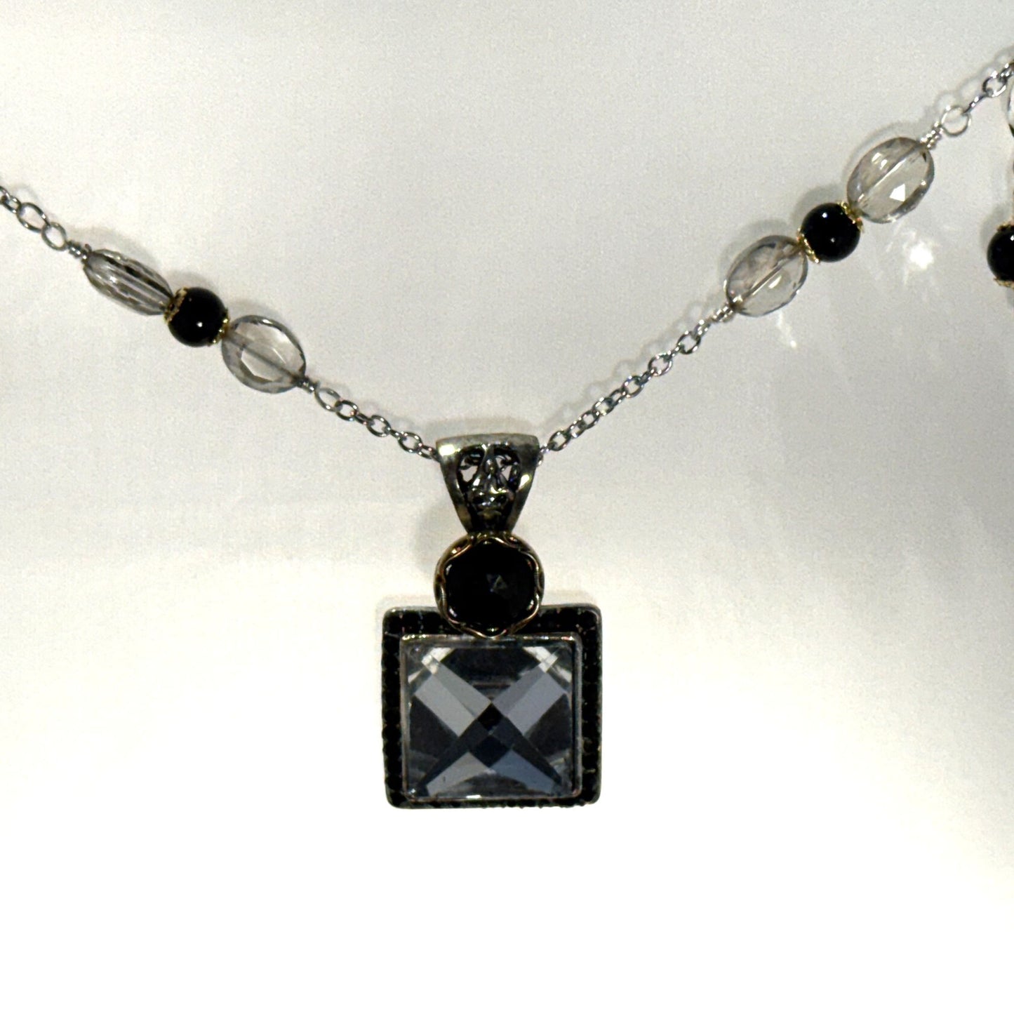 “Old-world charm, newly defined.” - Long mixed metals necklace