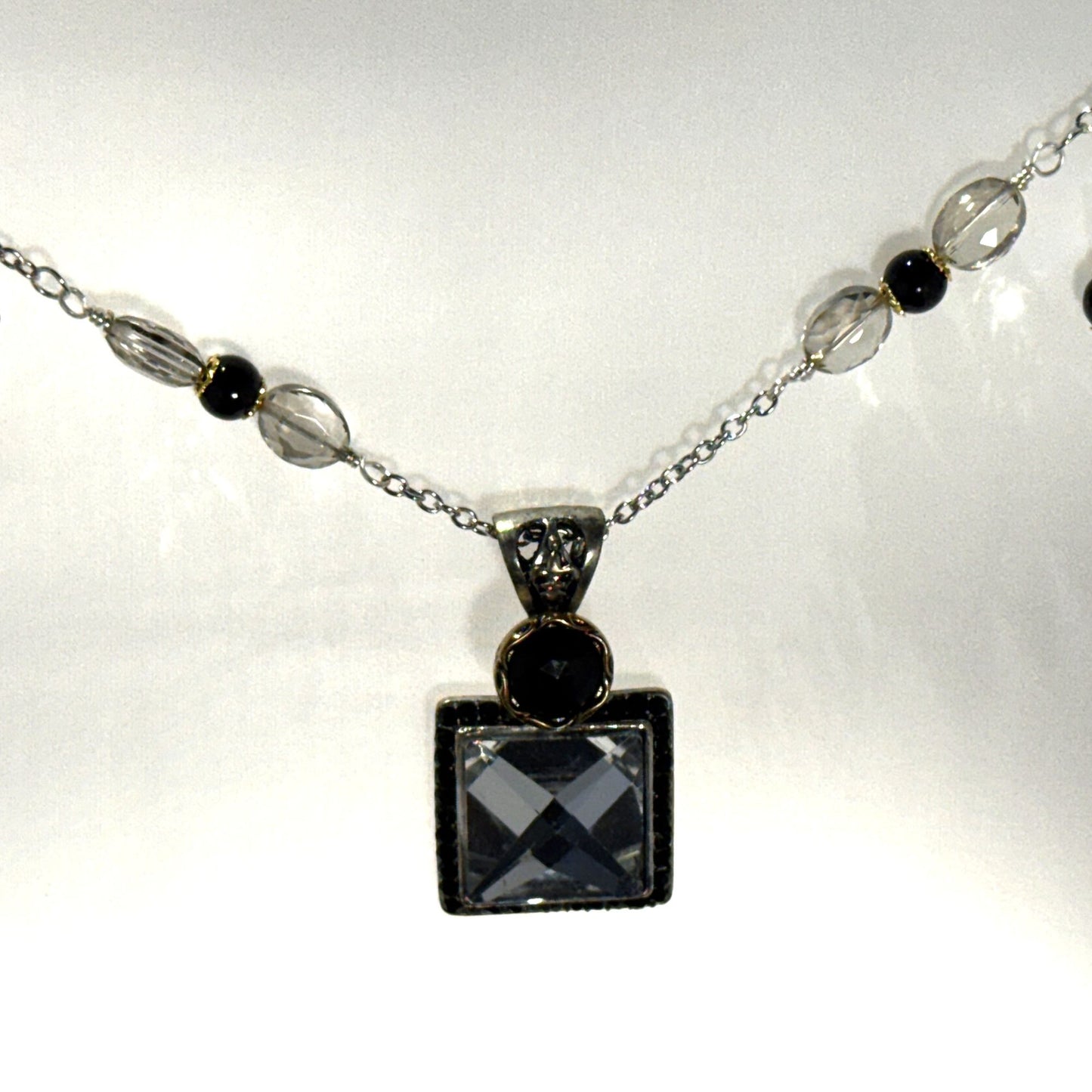 “Old-world charm, newly defined.” - Long mixed metals necklace