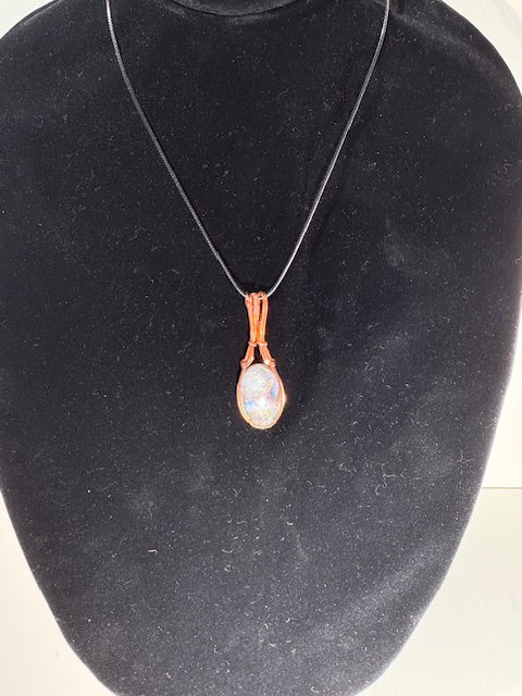 “Light captured in copper’s embrace.”